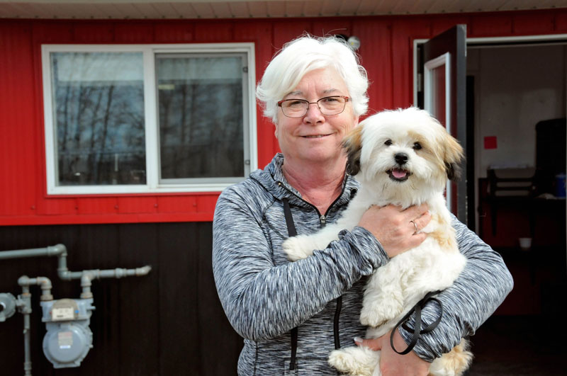 Canine guest going home with their owner after boarding. Canine guest going home with their owner after boarding.