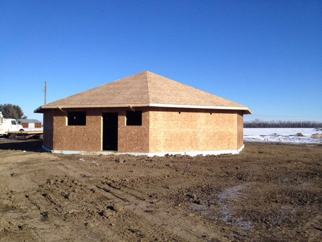 Octagon dog kennel design being framed. Octagon dog kennel design being framed.